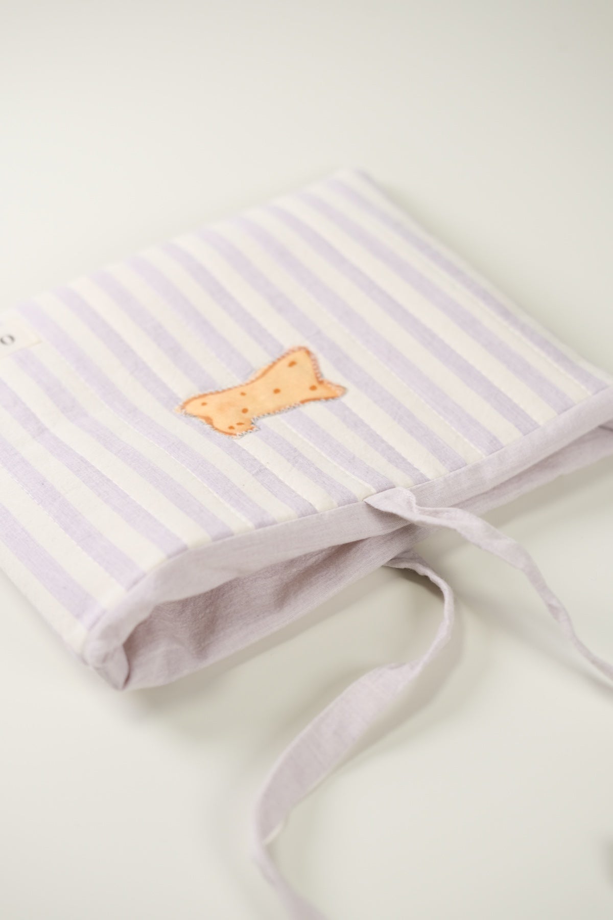 'Cat Cookies with Lavender Milk' Quilted Book Sleeve (Striped)